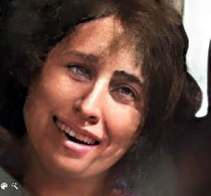 A head shot of a woman with dark hair.