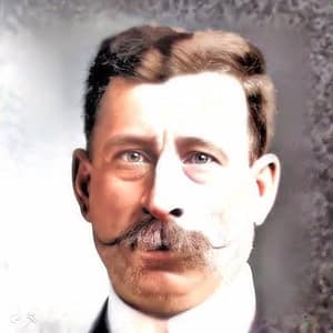 Headshot of a male with red hair on his head and a red mustache.