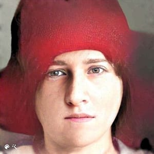 Portrait of a young lady in a red hat.