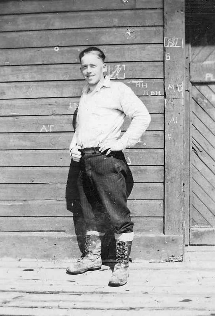 Gentleman standing in breeches and furlined work boots.