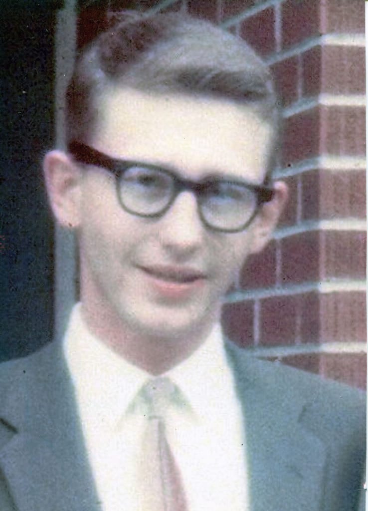 A portrait of a man in a shirt and tie.