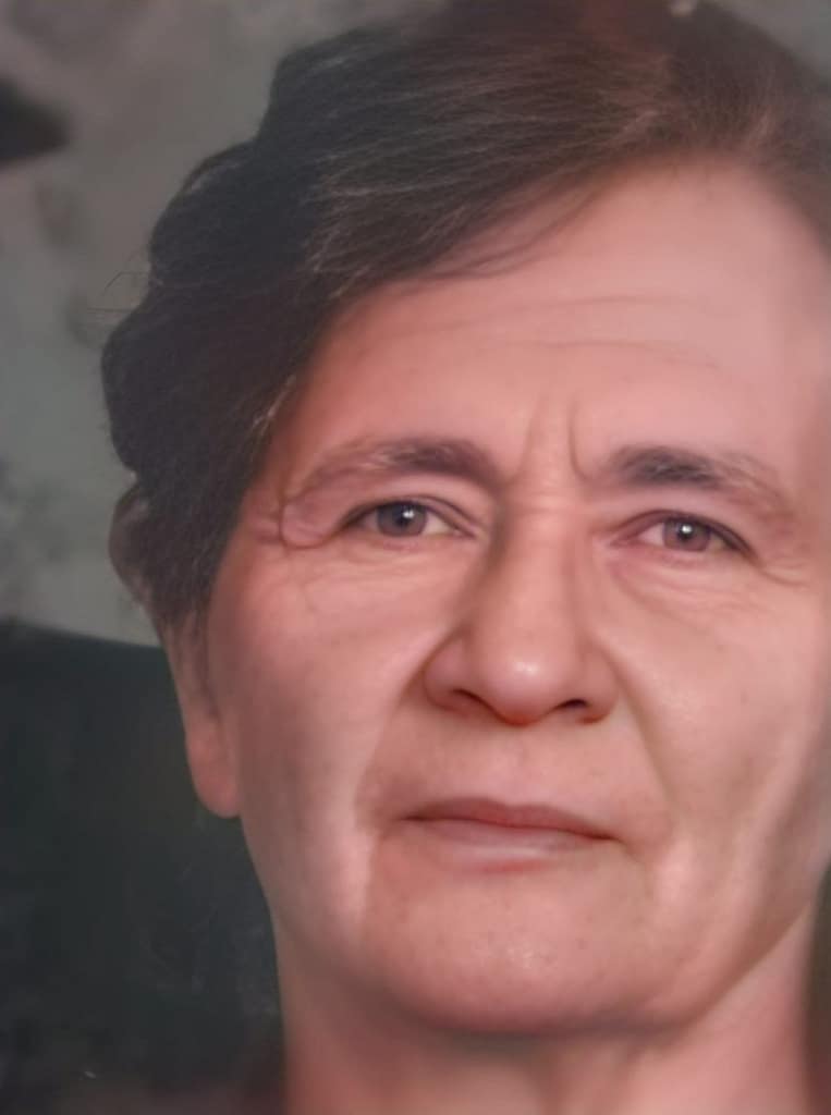 Headshot of a woman with dark hair.