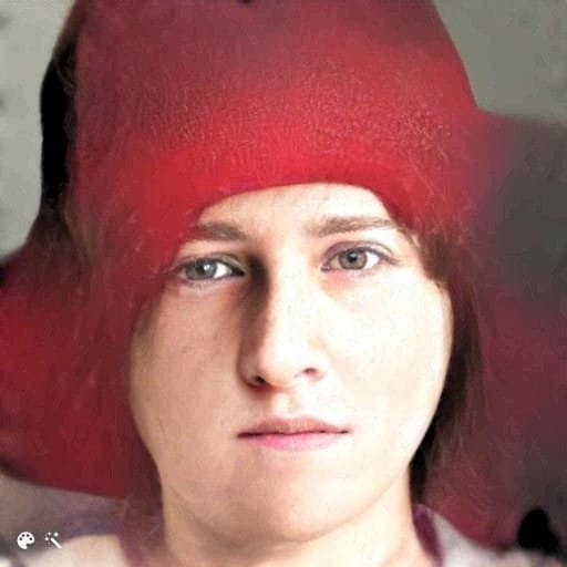 Portrait of a young lady in a red hat.