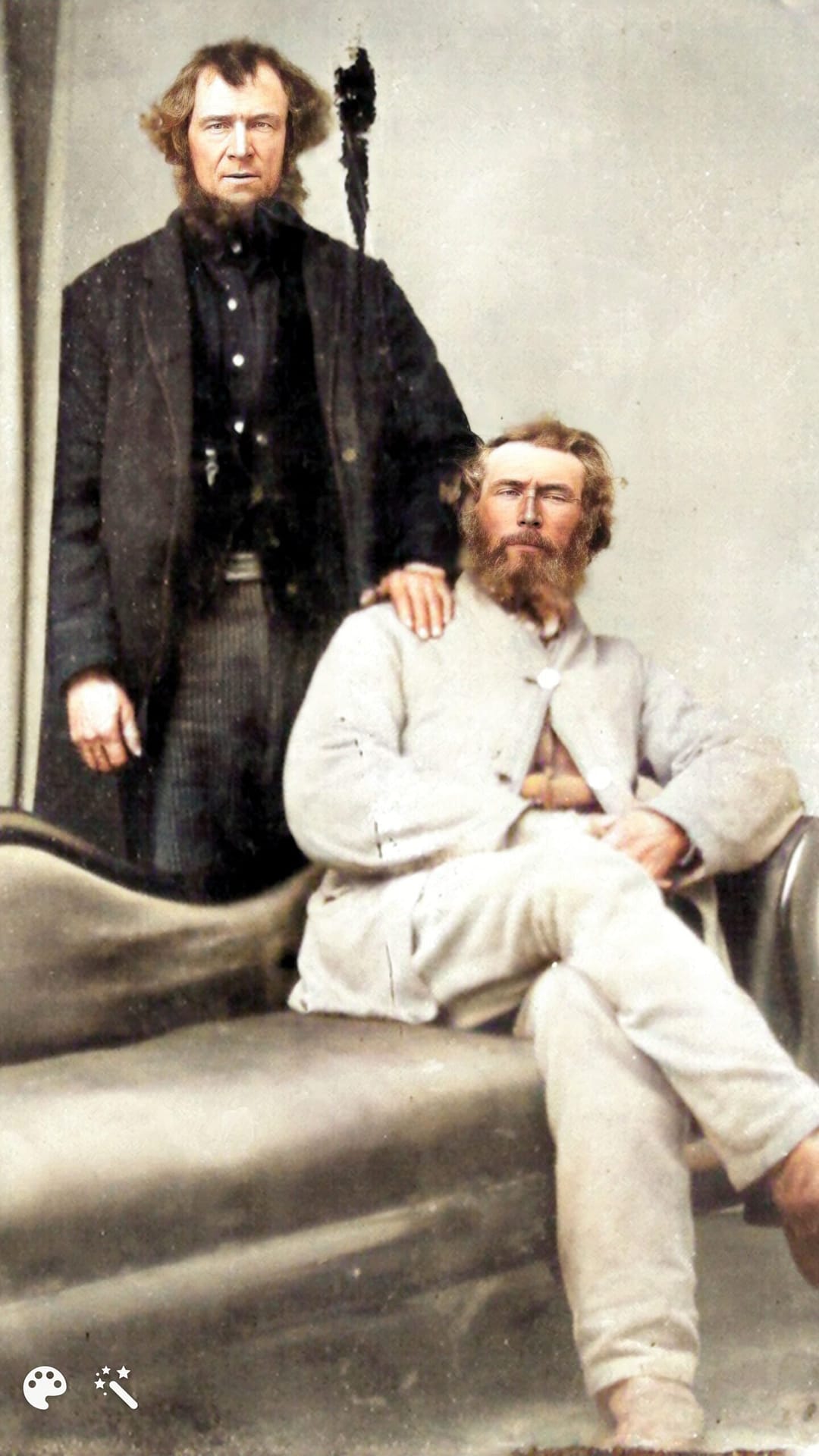 This picture is shown in black and in colour. It is of John Brown our great, great grandfather sitting with John Eades his son-in-law (standing) with his hand on John's shoulder.